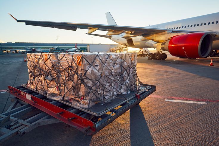 Air cargo pallets prepared in Chinese airport representing freight charges to global markets