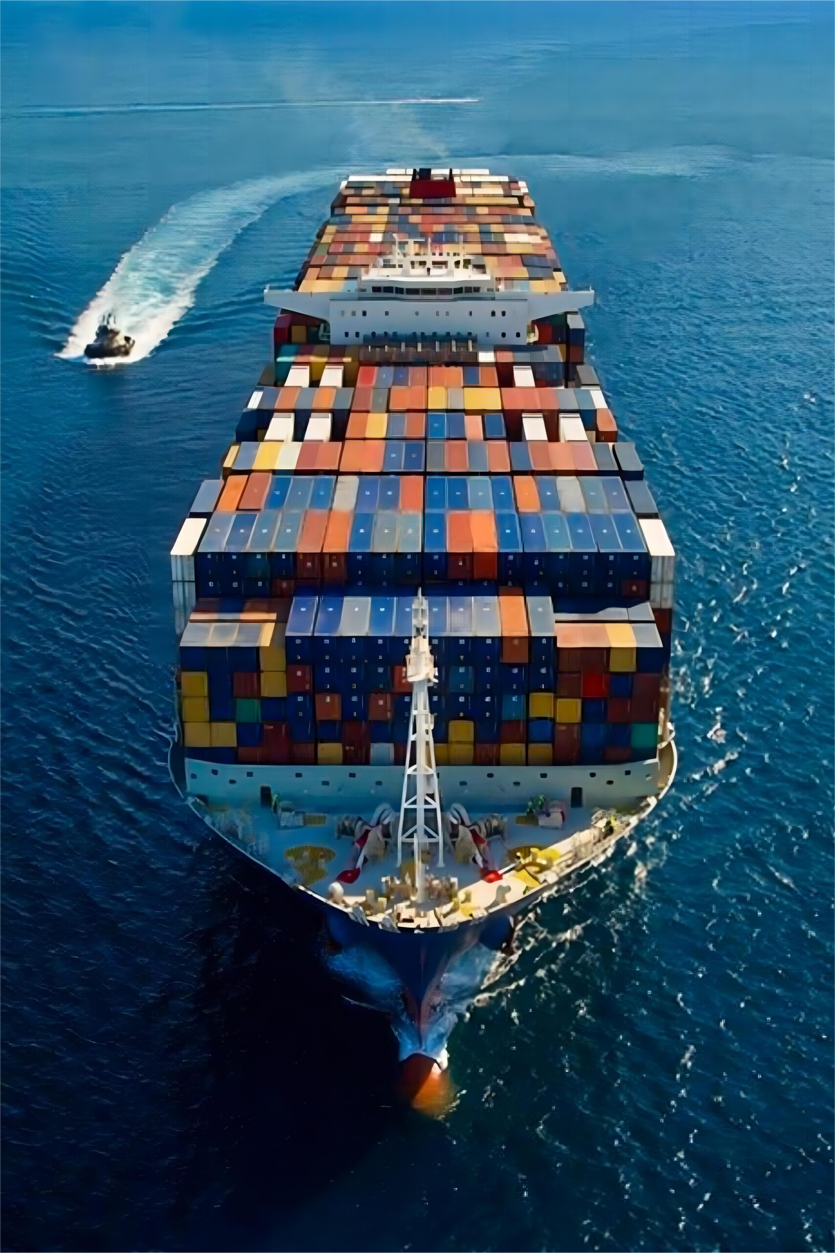 Example of a large industrial machine being secured on a flat rack container