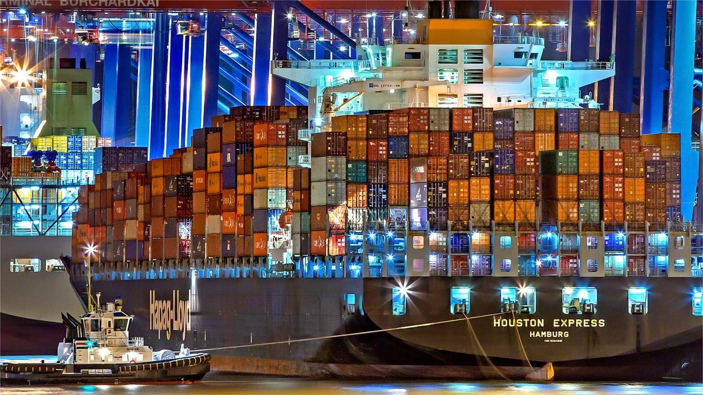 A 40HQ shipping container being loaded with machinery at a Chinese port