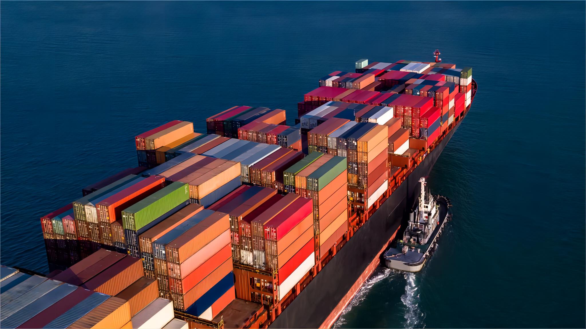 Cargo ship transporting containers across the Mediterranean toward Spain