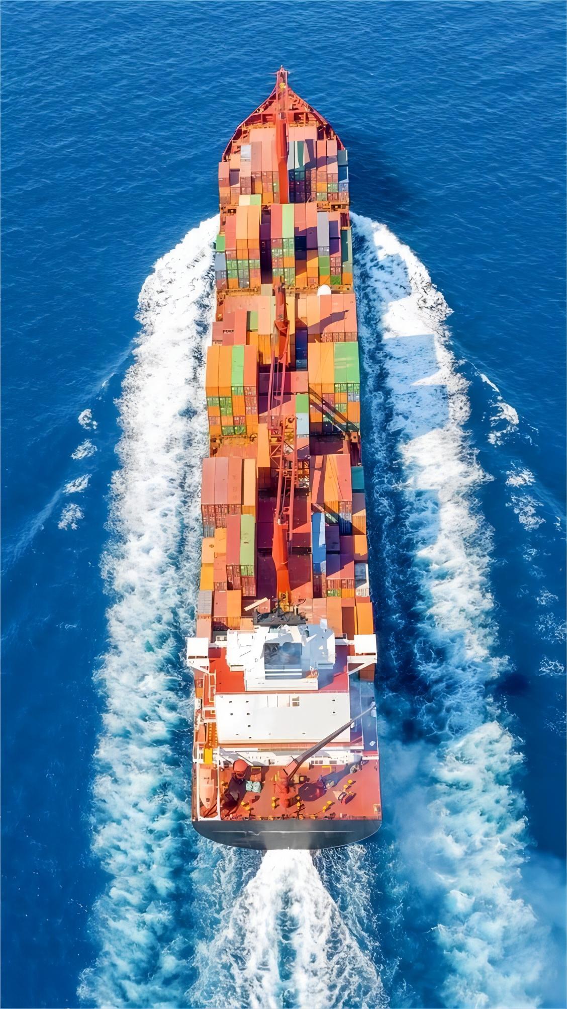 Flat rack container being loaded with textile machinery at a Chinese port
