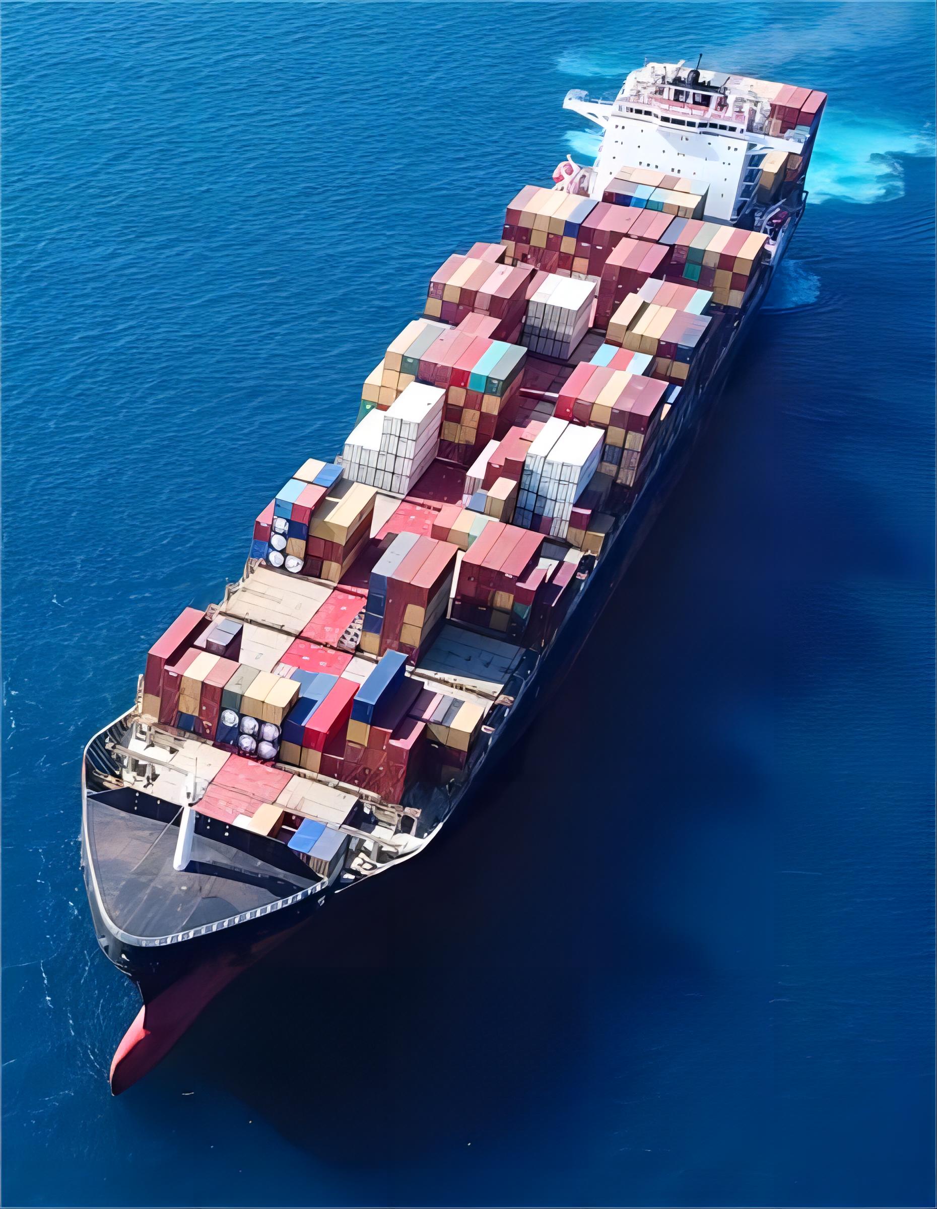 Heavy duty flat rack container loaded with oversized toy manufacturing equipment at a Chinese port
