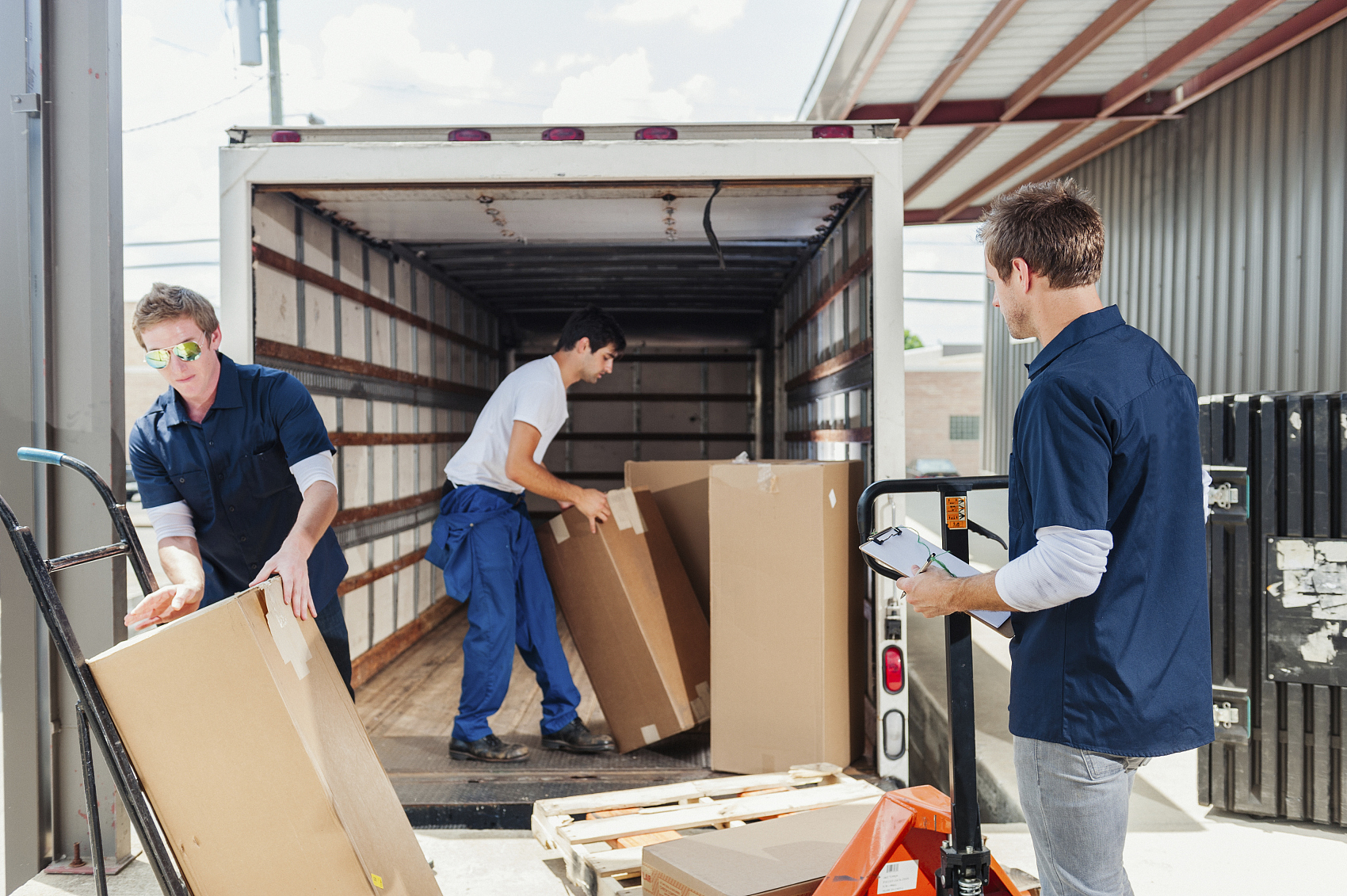 A 40GP container being loaded with lighting equipment for UK export