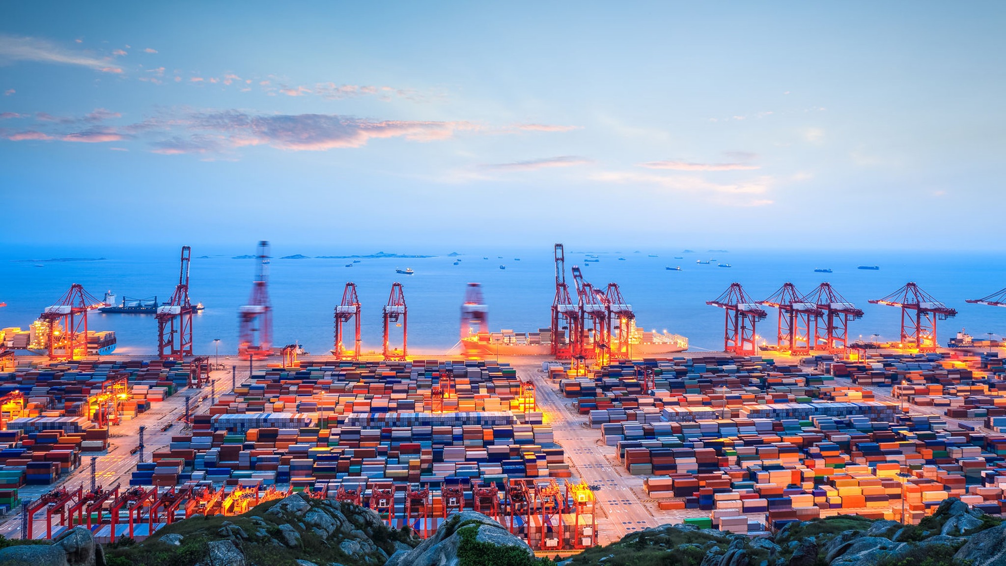 Solar panels being loaded into a 40GP container at a Chinese port